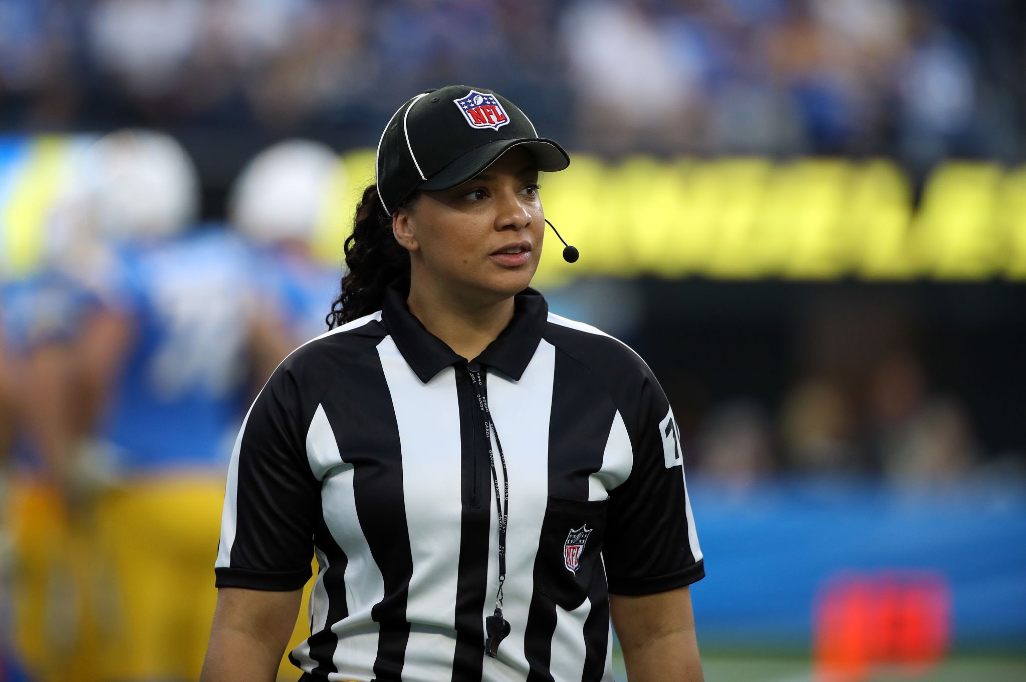 Maia Chaka officiating on the field as an NFL and NCAA Division I official